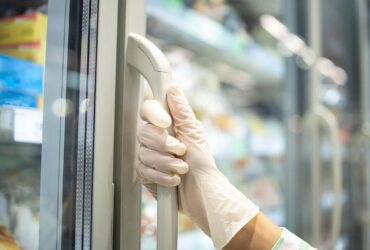 Someone opening a display freezer